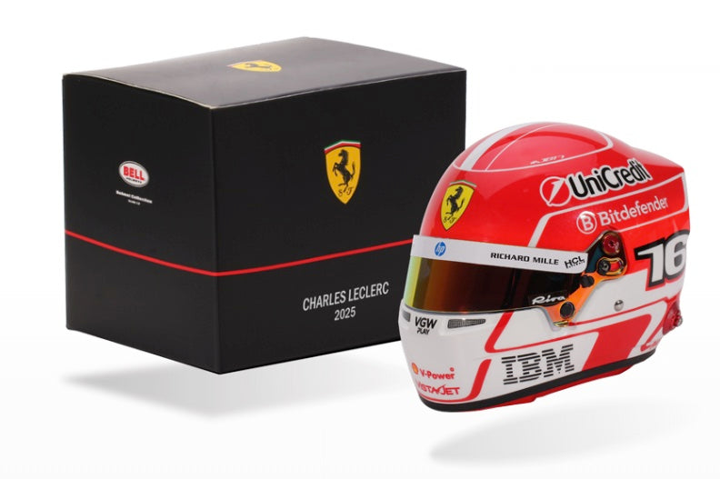 Ferrari Charles LeClerc racing helmet with sponsor logos next to a black box featuring the Ferrari logo.
