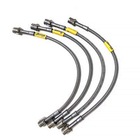 Thumbnail for Set of four Goodridge G-Stop brake hoses with yellow connectors on a white background