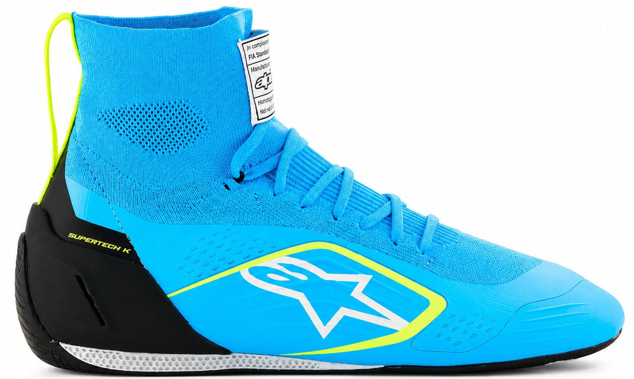 Alpinestars Supertech K karting shoe in blue with fluorescent yellow accents, shown in a straight right-facing side view on a white background.