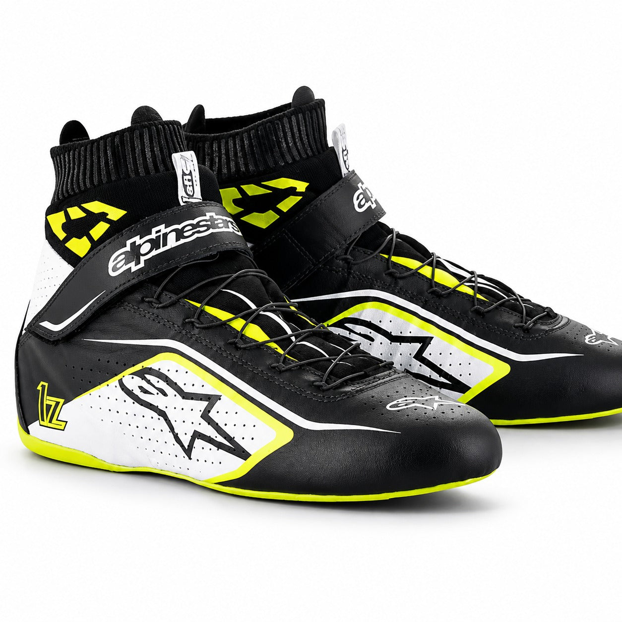 Alpinestars Tech-1 Z V2 racing shoes in black, white, and neon yellow with high-top ankle support and lightweight motorsport design