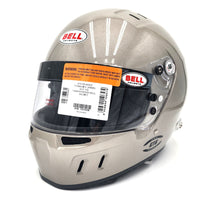 Thumbnail for Close-up of Bell GT6 RD 4C/EC SA2025 helmet in titanium finish with barcode label and SNELL/FIA certifications