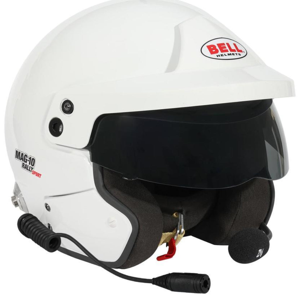Angled view of Bell MAG-10 Rally Sport white helmet showing open-face visor, padded interior, and attached rally microphone image