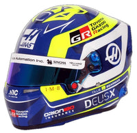 Thumbnail for Bell Oliver Bearman 2026 F1 mini helmet front three-quarter view with blue, yellow and white Haas racing graphics