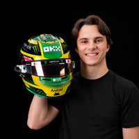 Thumbnail for Oscar Piastri holding Bell 2026 Australian GP 1:2 scale mini helmet
