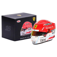 Thumbnail for Charles Leclerc 2026 F1 mini helmet shown with larger faded helmet comparison on white background