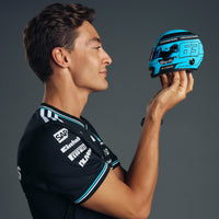 Thumbnail for George Russell holding Bell HP77 2025 Mini Helmet side profile showing number 63 design