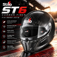 Thumbnail for Stilo ST6 FN Carbon Fiber FIA 8860-2018 racing helmet featuring exposed carbon weave, clear visor, advanced ventilation, and lightweight motorsport construction against a dramatic racetrack background.