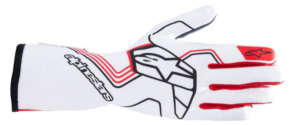 Flat lay of the gloves against a racing-themed backdrop, emphasizing their professional grade